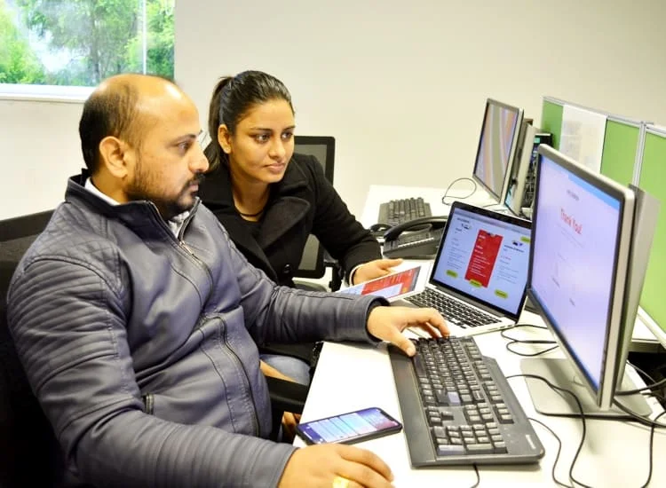 Net Solutions employees building products on various platforms | Mobile app development services