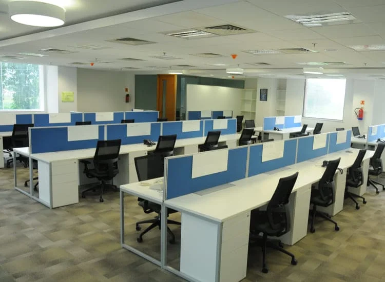 Net Solutions development office with white desks and black chairs